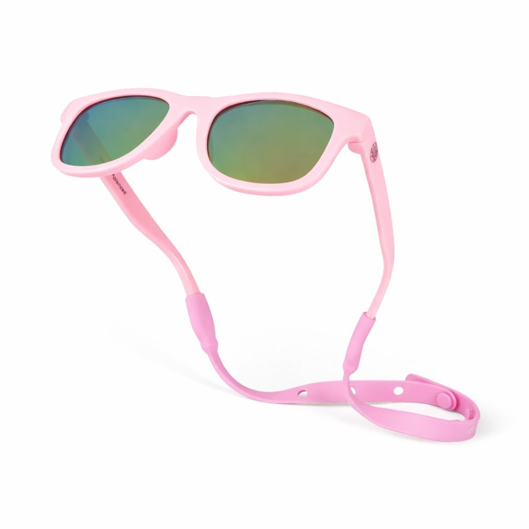 Pink sunglasses with a matching strap on a white background