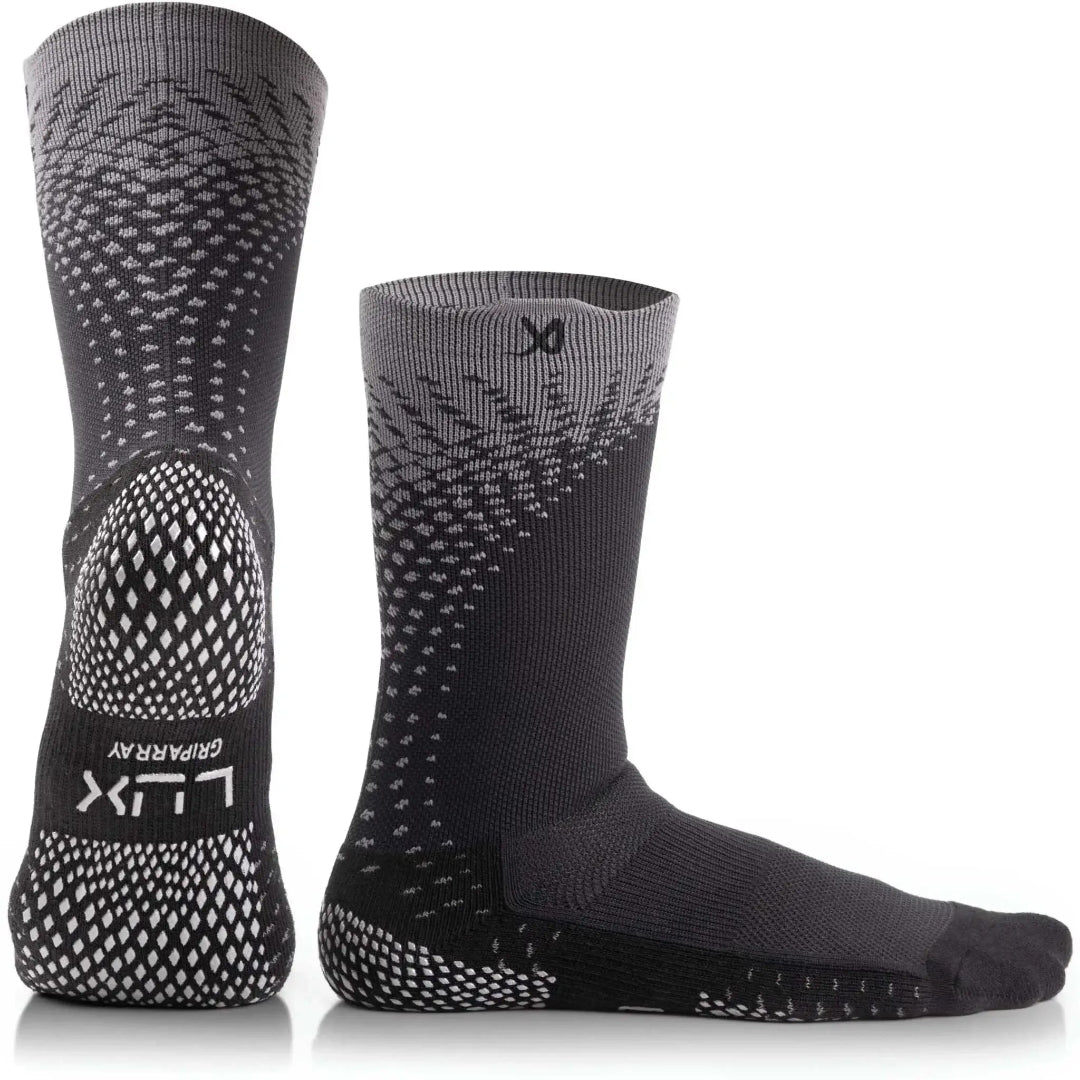 Pair of black and gray socks with unique patterns on a white background