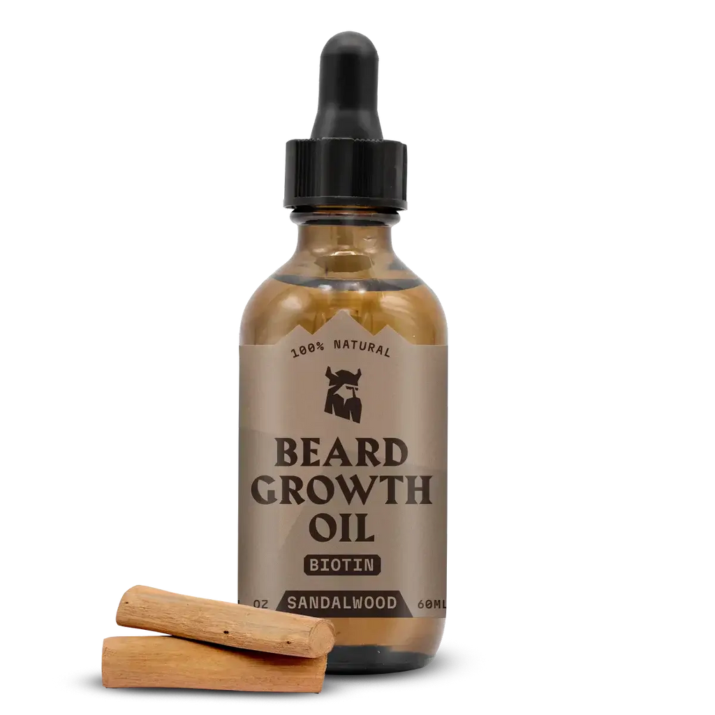 Beard Growth Oil Biotin Sandalwood bottle with sandalwood pieces.