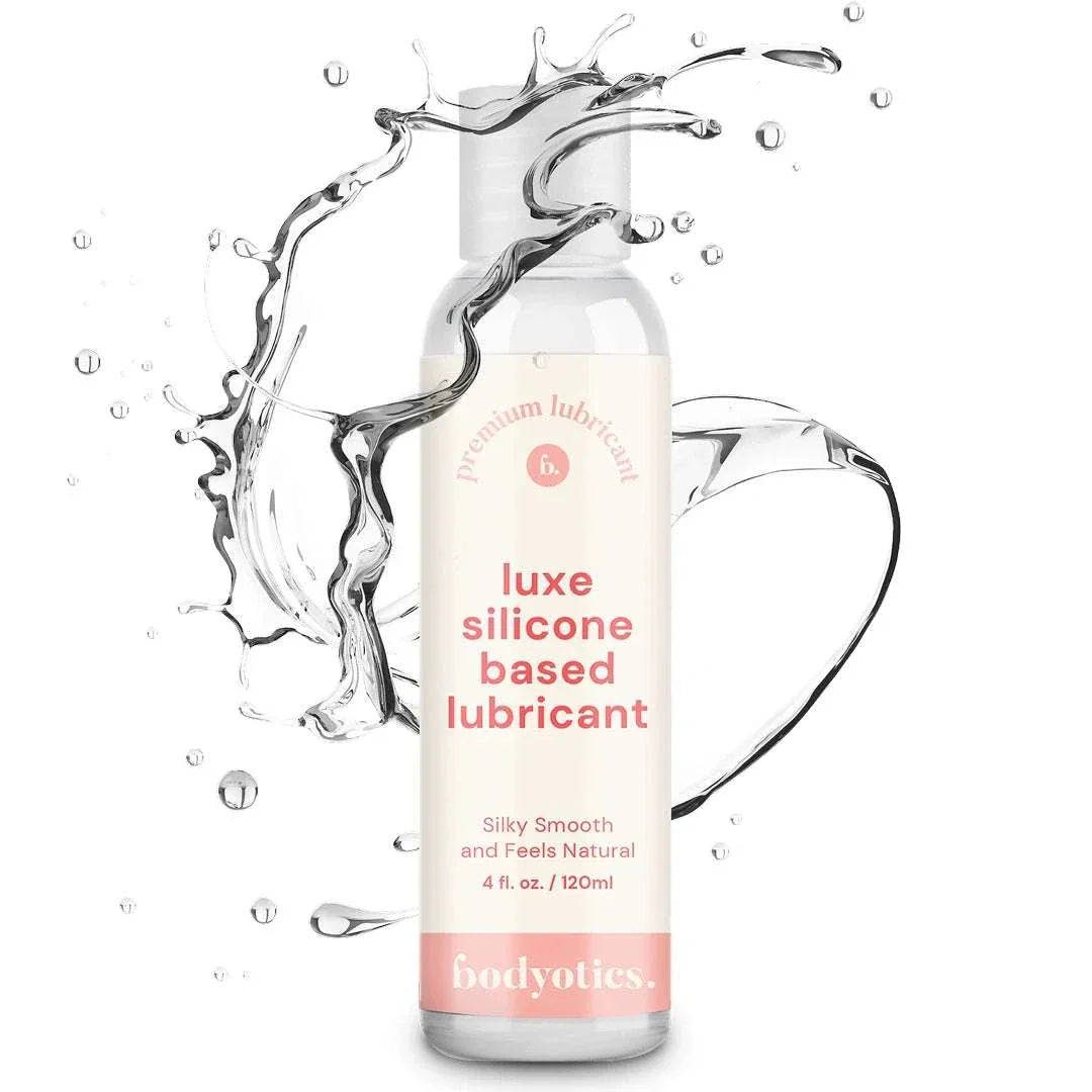 Bodyotics Premium Silicone Based Lubricant 4oz bottle with clear liquid splash, silky smooth and long-lasting formula for sensitive skin and intimate pleasure.