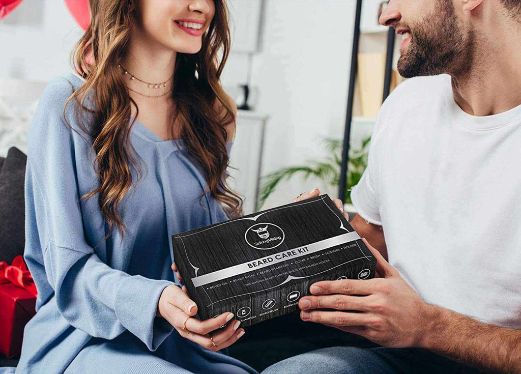 Beard kit with caddy in a sleek gift box exchanged between two people.