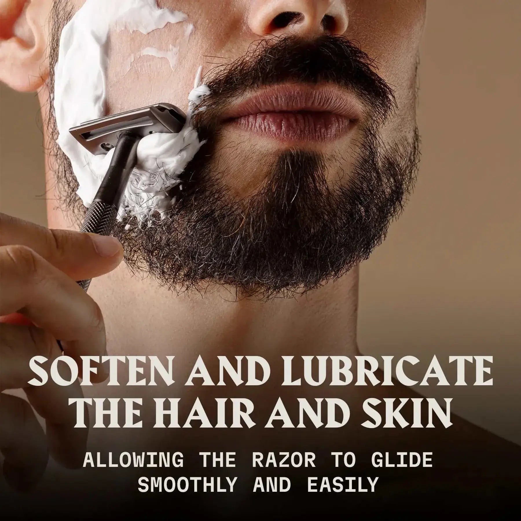 Man applying shaving cream with razor, promoting Striking Viking Pre-Shave Oil for smooth and effortless shave with sandalwood scent.