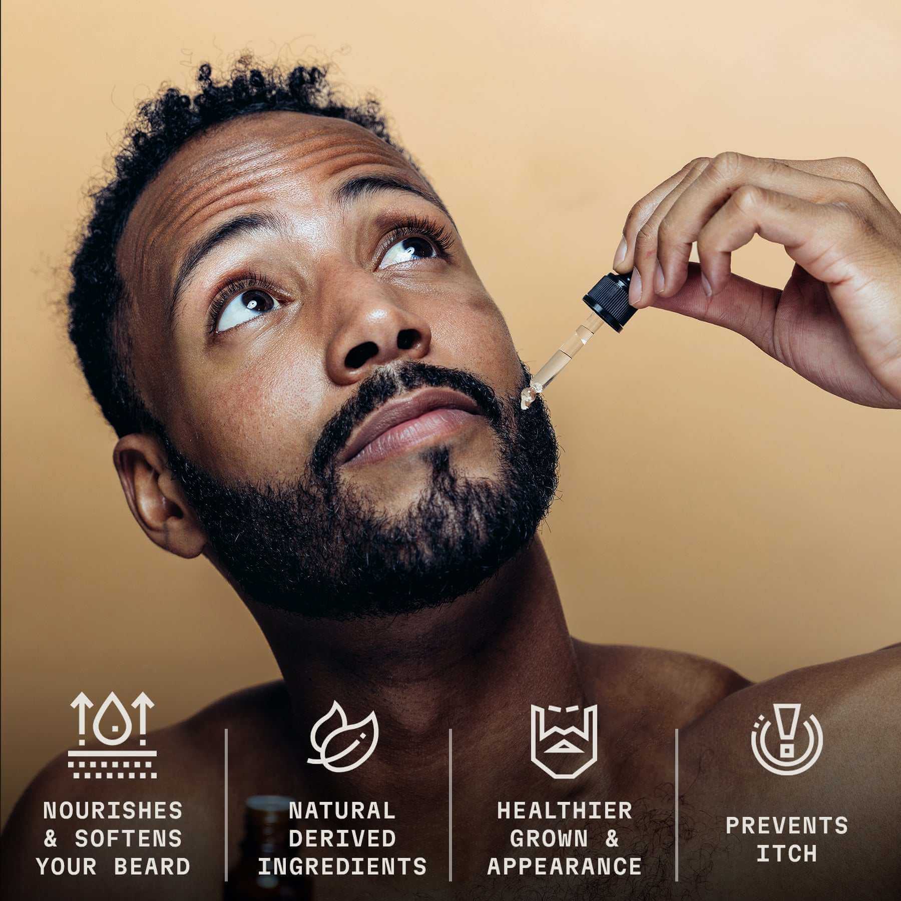 Bearded man applying unscented beard oil with dropper for nourishment and softness.